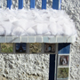 Blue and white French chair with picture tiles and a padded seat