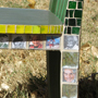 Kansas chair with picture tiles of famous Kansans and colorful mosaic tiles covering the surface